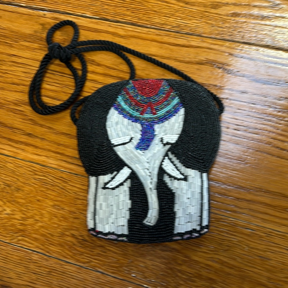 Beaded elephant shaped snap closure mini bag.  Great condition. No brand.